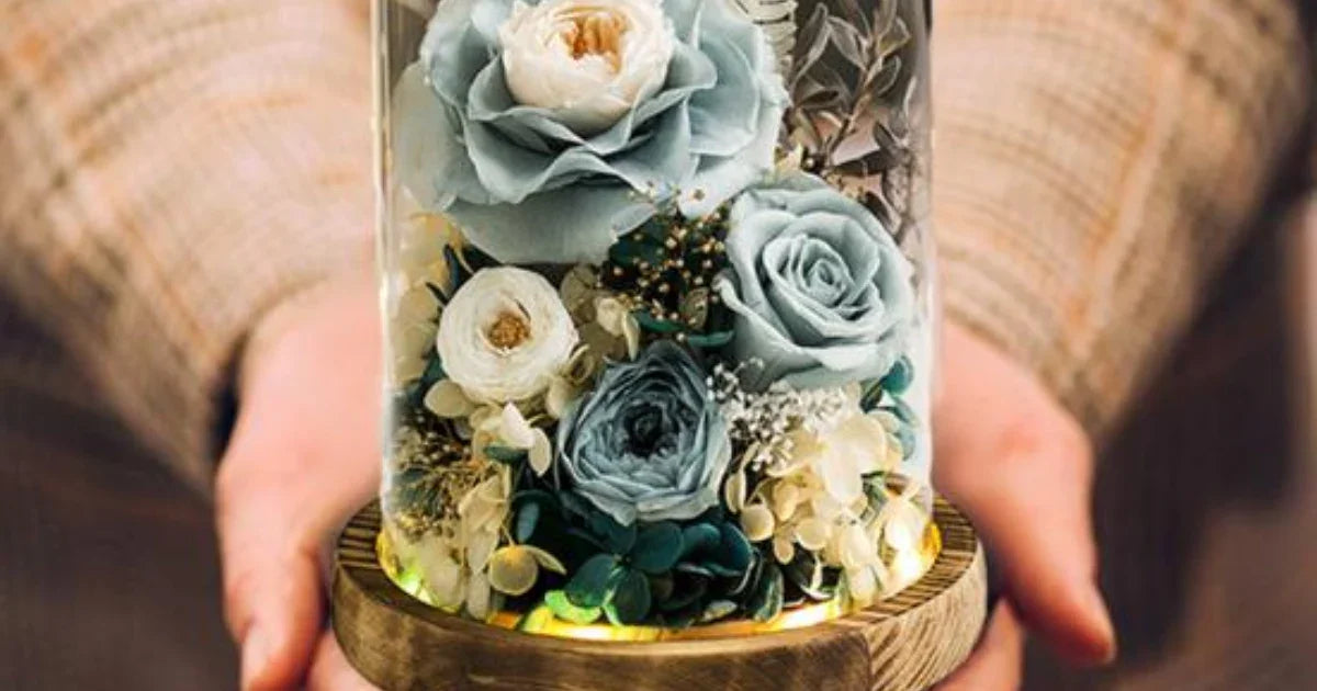 Preserved blue and white roses in a glass dome with wooden base, LED lights, unique gift