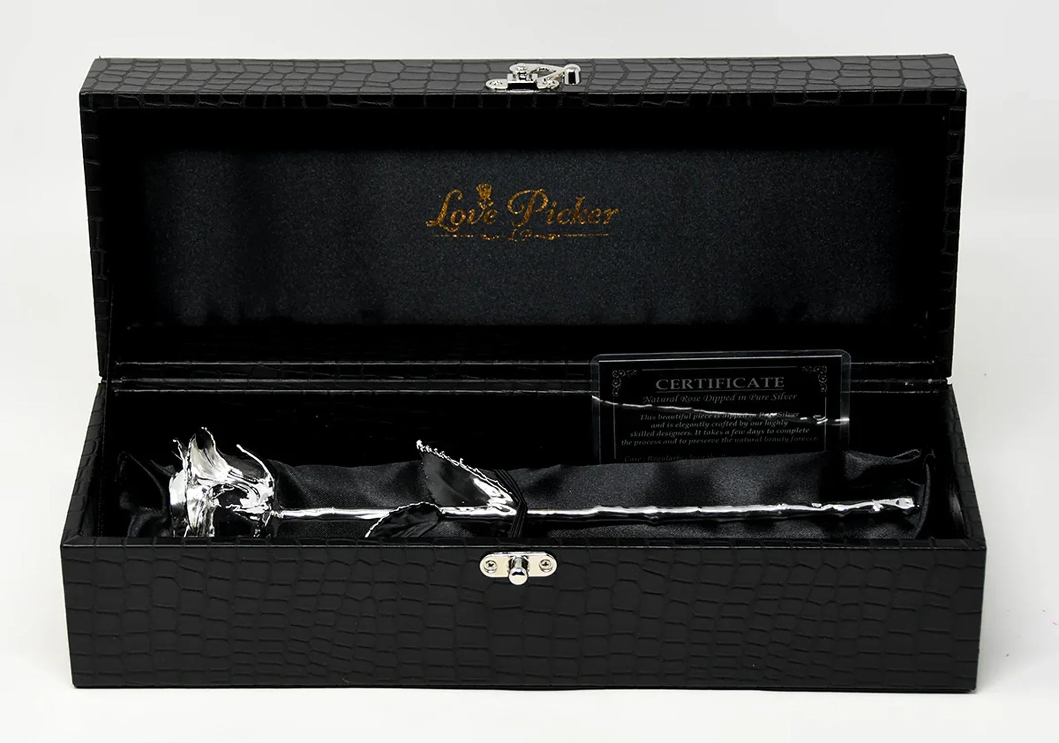 A silver-dipped real rose displayed in a black textured leather gift box with satin lining and a certificate of authenticity, part of LovePicker’s luxury “Gifts for Him” collection.