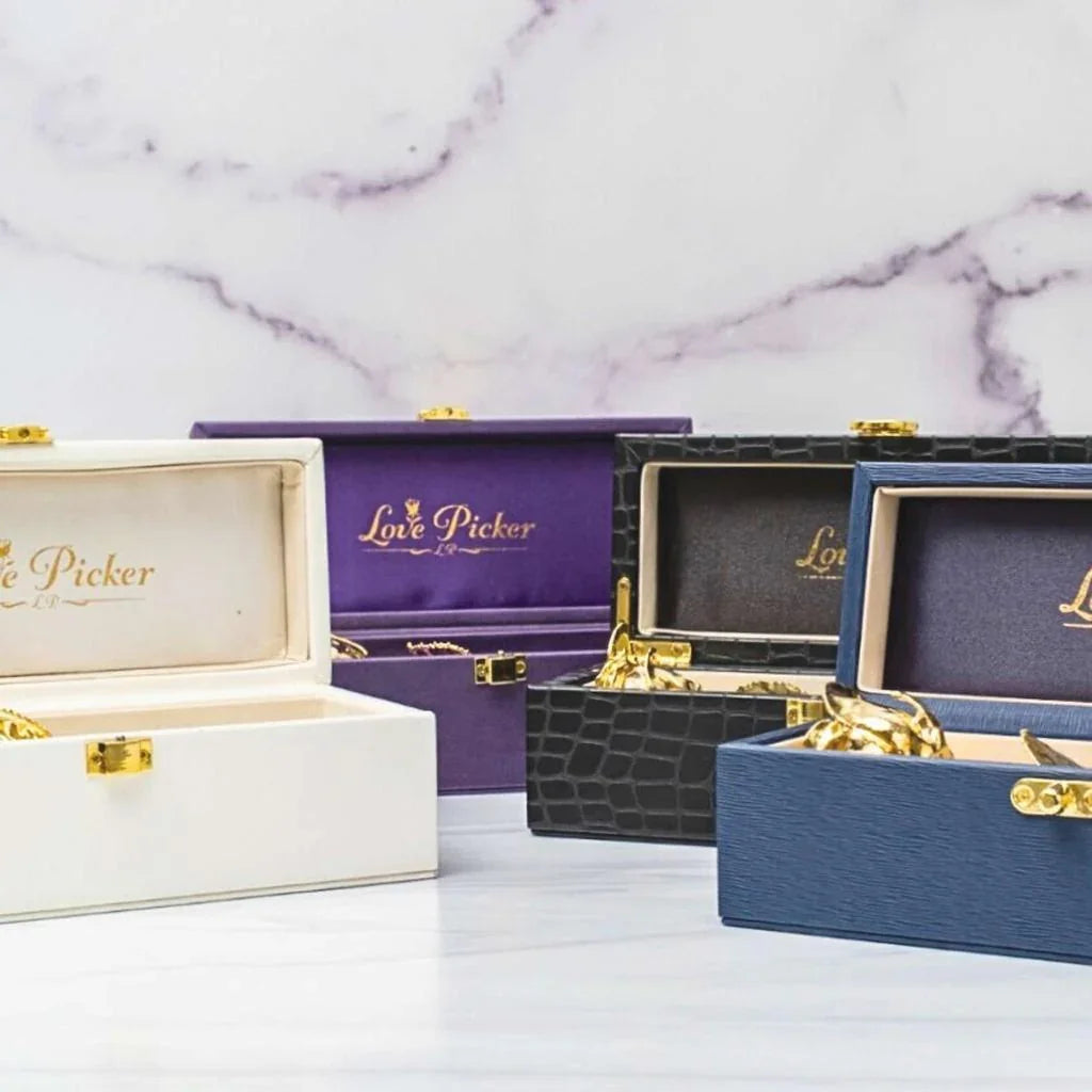 Luxury display vases in gold, silver, and rose gold finishes with preserved rose gift boxes, Lovepicker collection photo with gold ball accent 24k gold dipped gifts