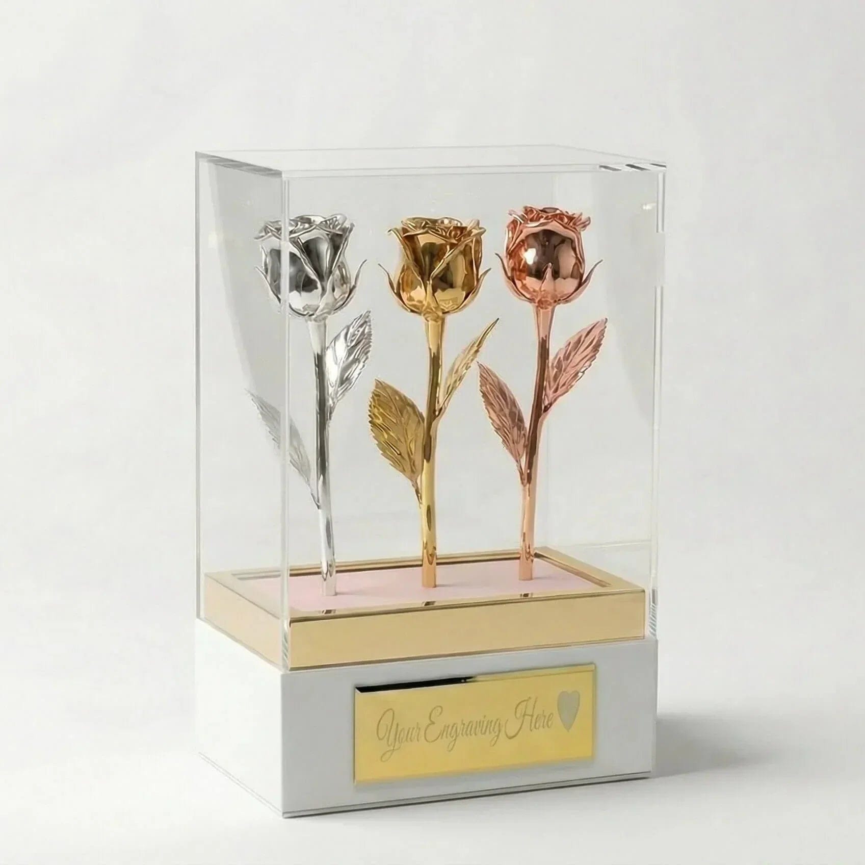 Tricolor preserved roses in silver, gold, and rose gold displayed in an acrylic gift box with customizable plaque.