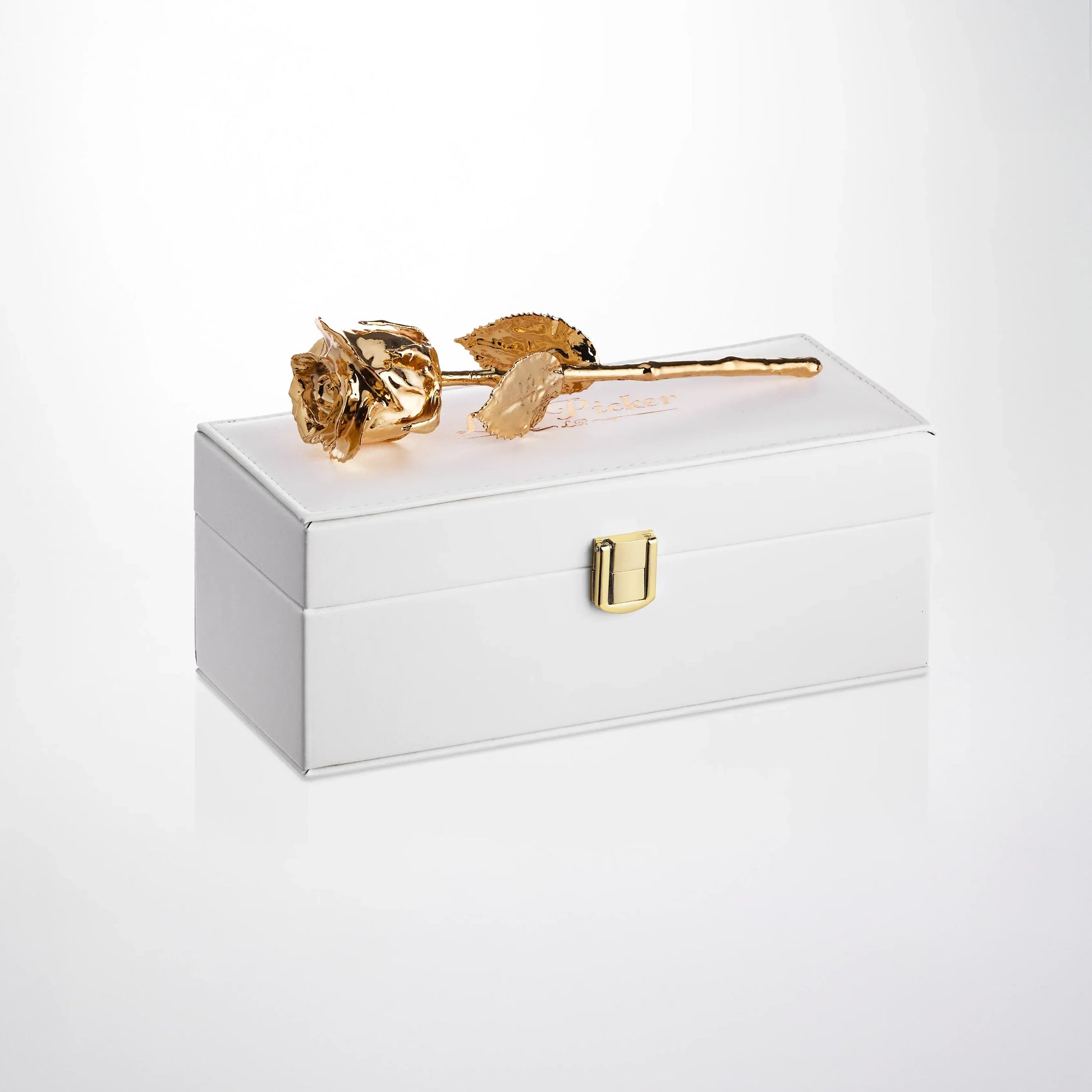 24K gold preserved rose displayed on a white gift box, luxury anniversary gift