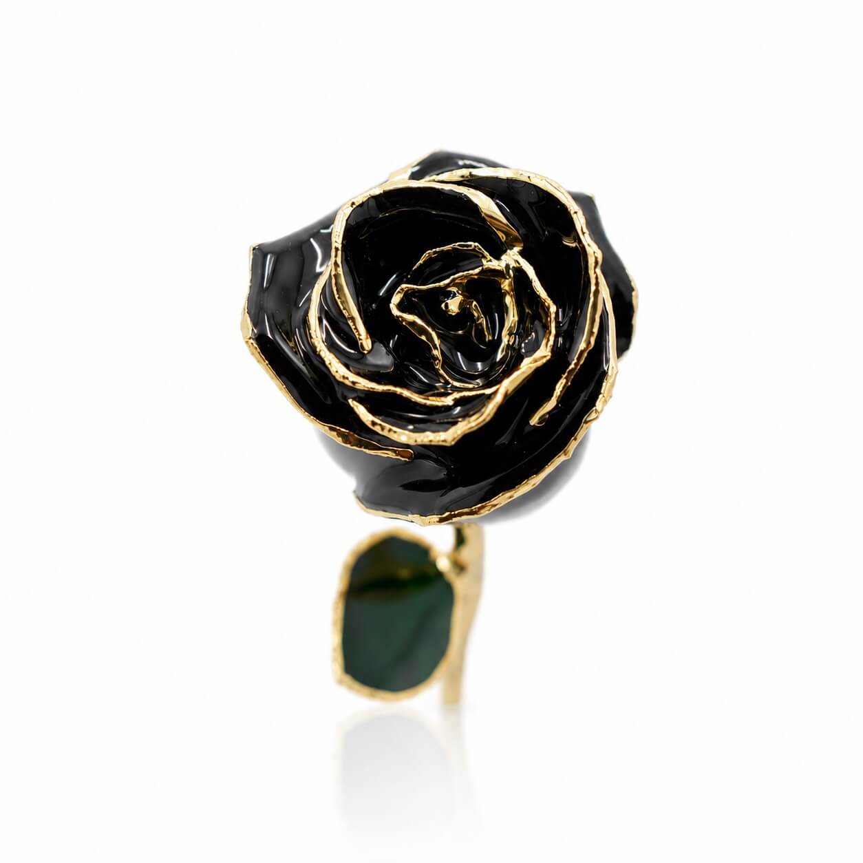 Black rose-shaped ring with gold accents on a white background