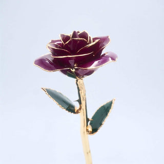 Dark purple open bloom preserved rose with 24K gold accents, angled half-length view