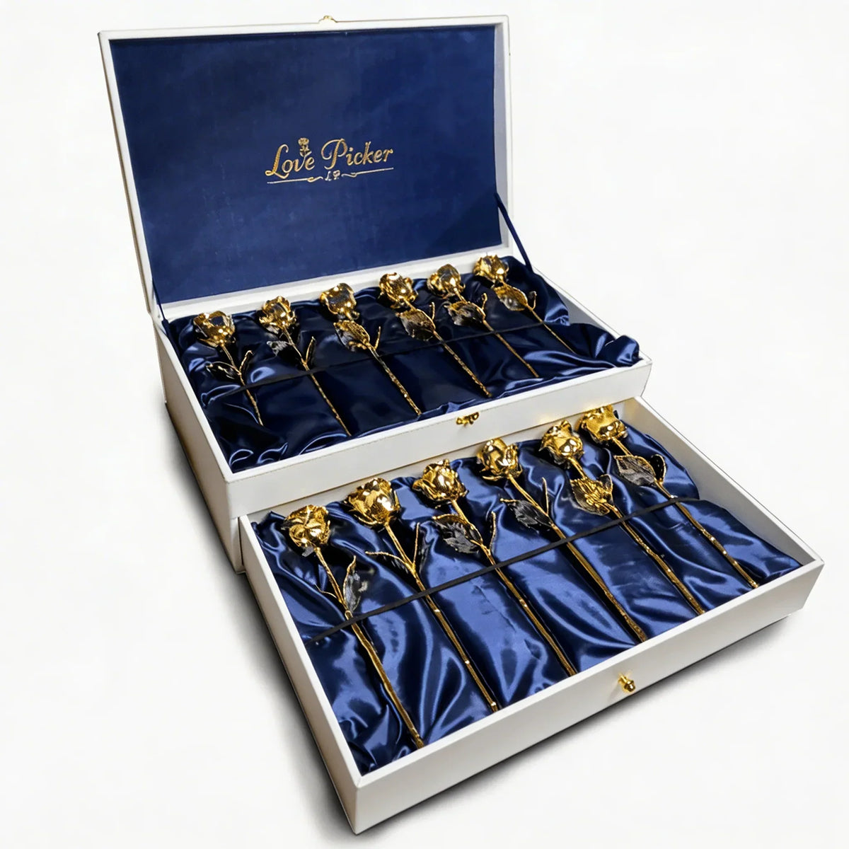 Box of preserved 24K gold roses arranged on blue satin, luxury gift presentation