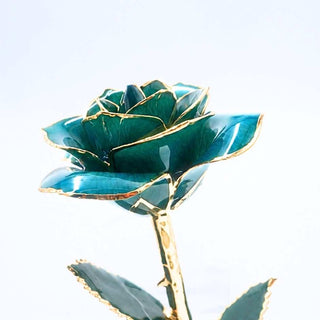Emerald green open bloom preserved rose with 24K gold accents, angled half-length view