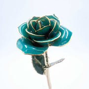 Emerald green open bloom preserved rose with 24K gold accents, angled half-length view