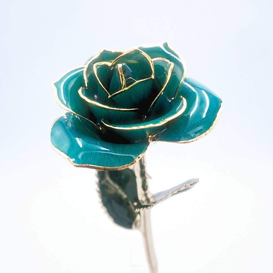 Emerald green open bloom preserved rose with 24K gold accents, angled half-length view