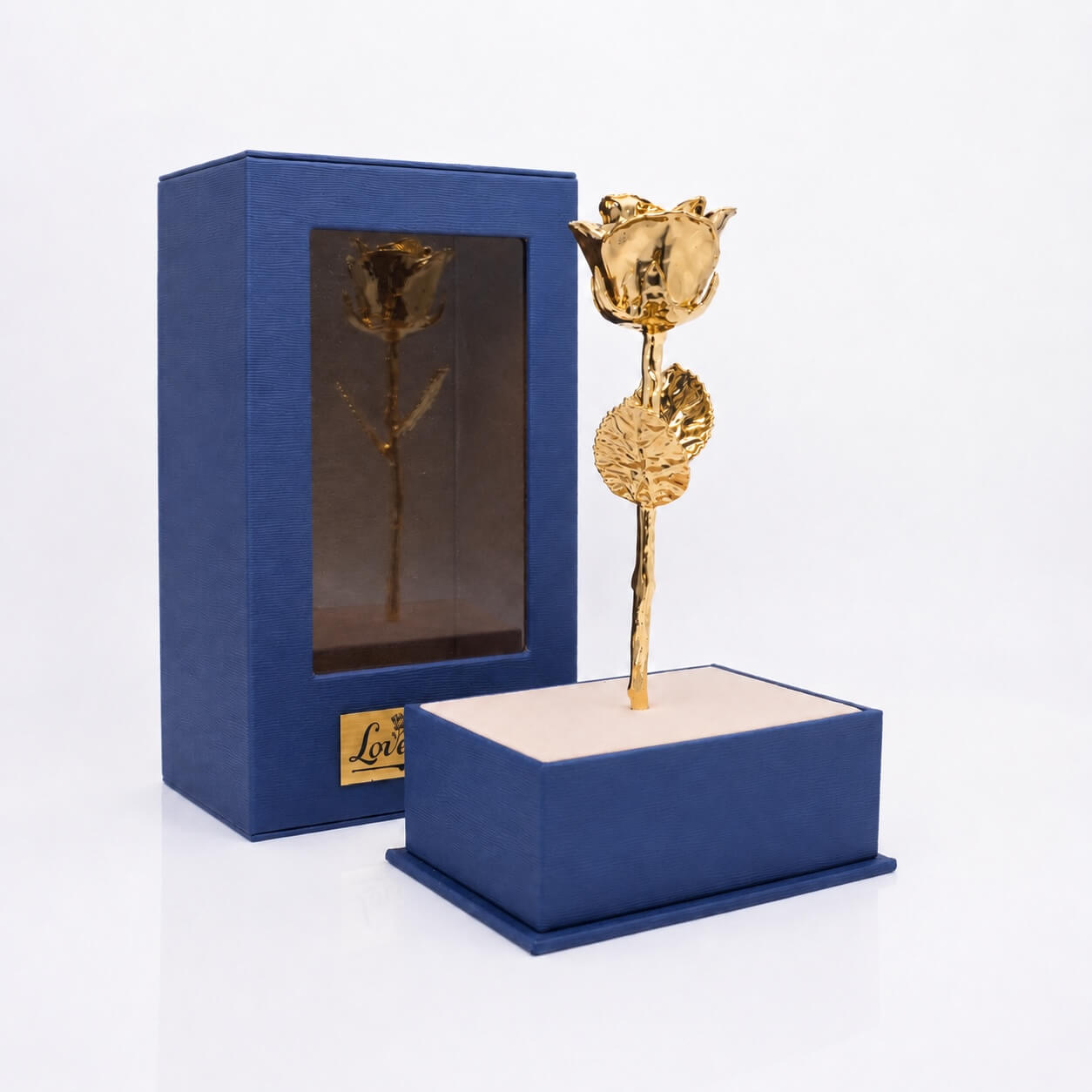 Gold rose in a blue box on a white background