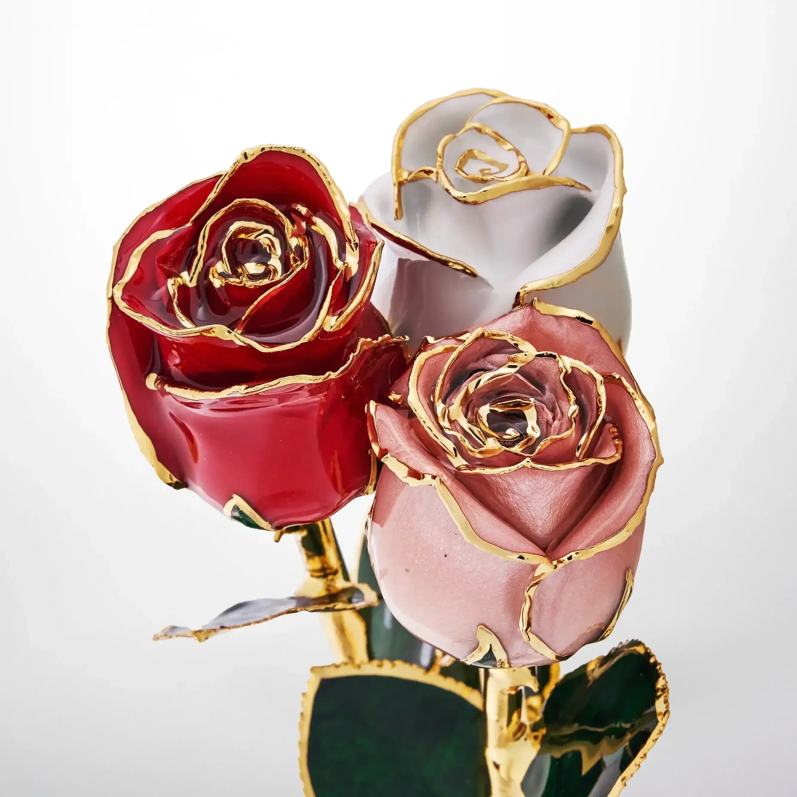Bouquet of preserved roses in red, pink, and white, trimmed with 24K gold detailing
