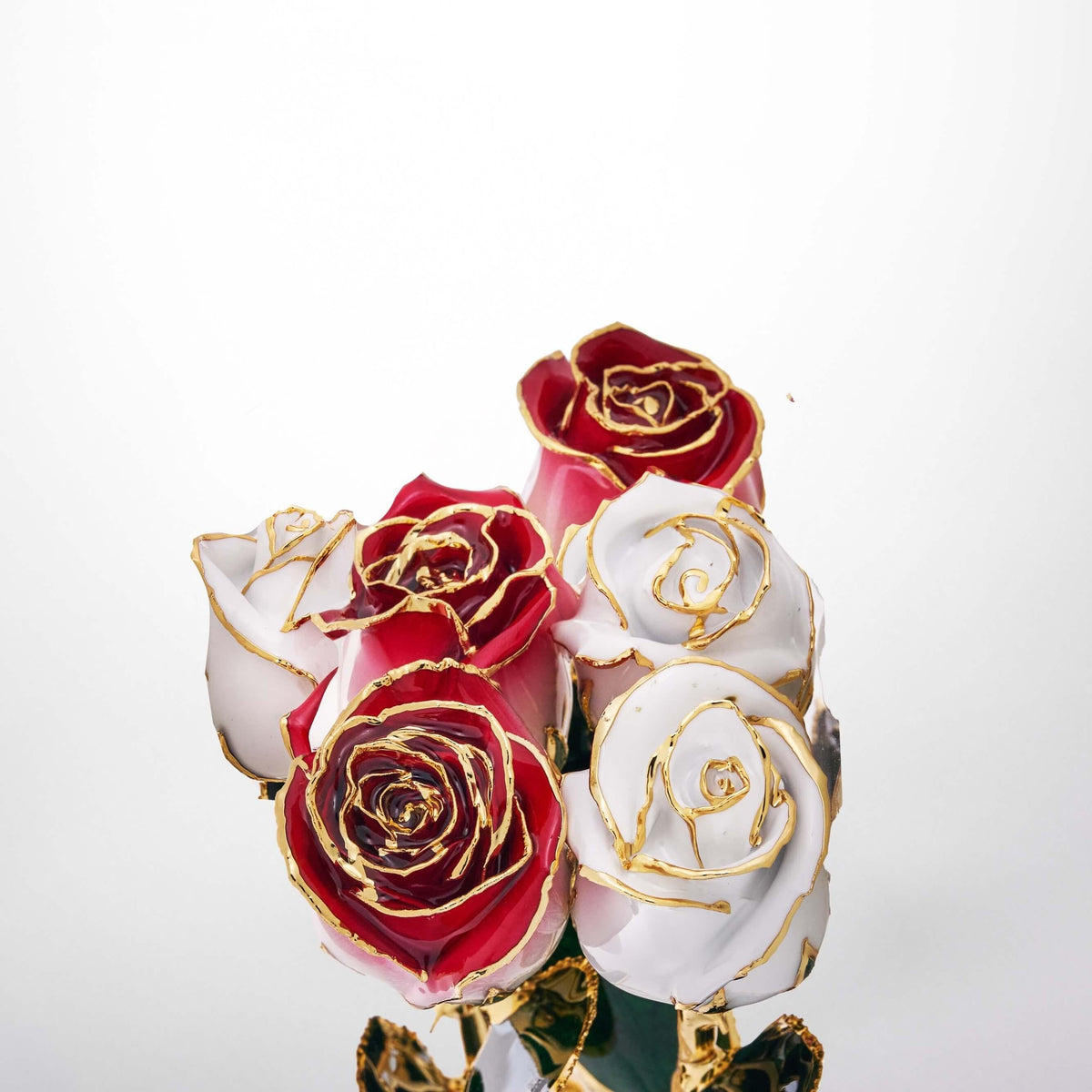 Crimson red 11.5-inch closed bud preserved rose with 24K gold accents, bloom close-up