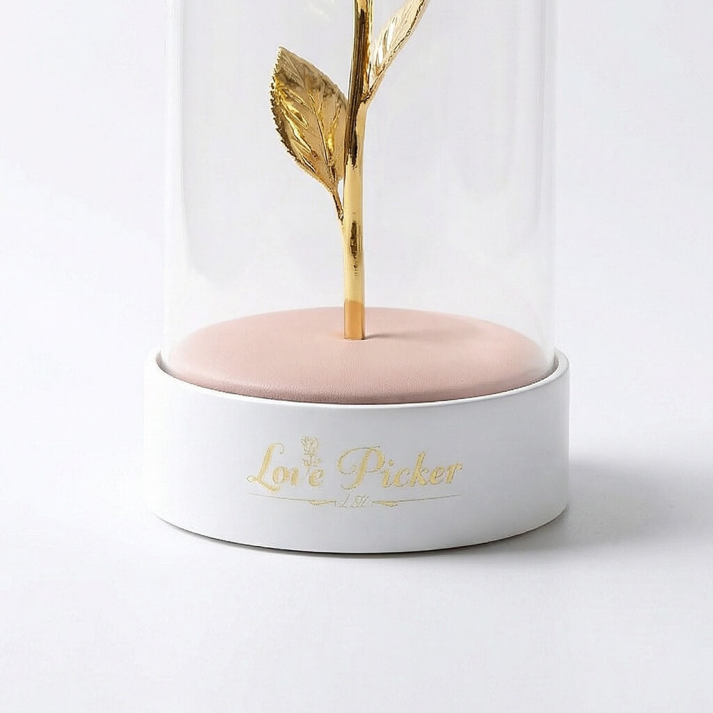 Decorative item with gold leaf and 'Love Picker' text on a white background