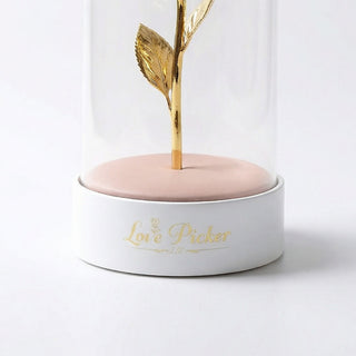 Decorative item with gold leaf and 'Love Picker' text on a white background