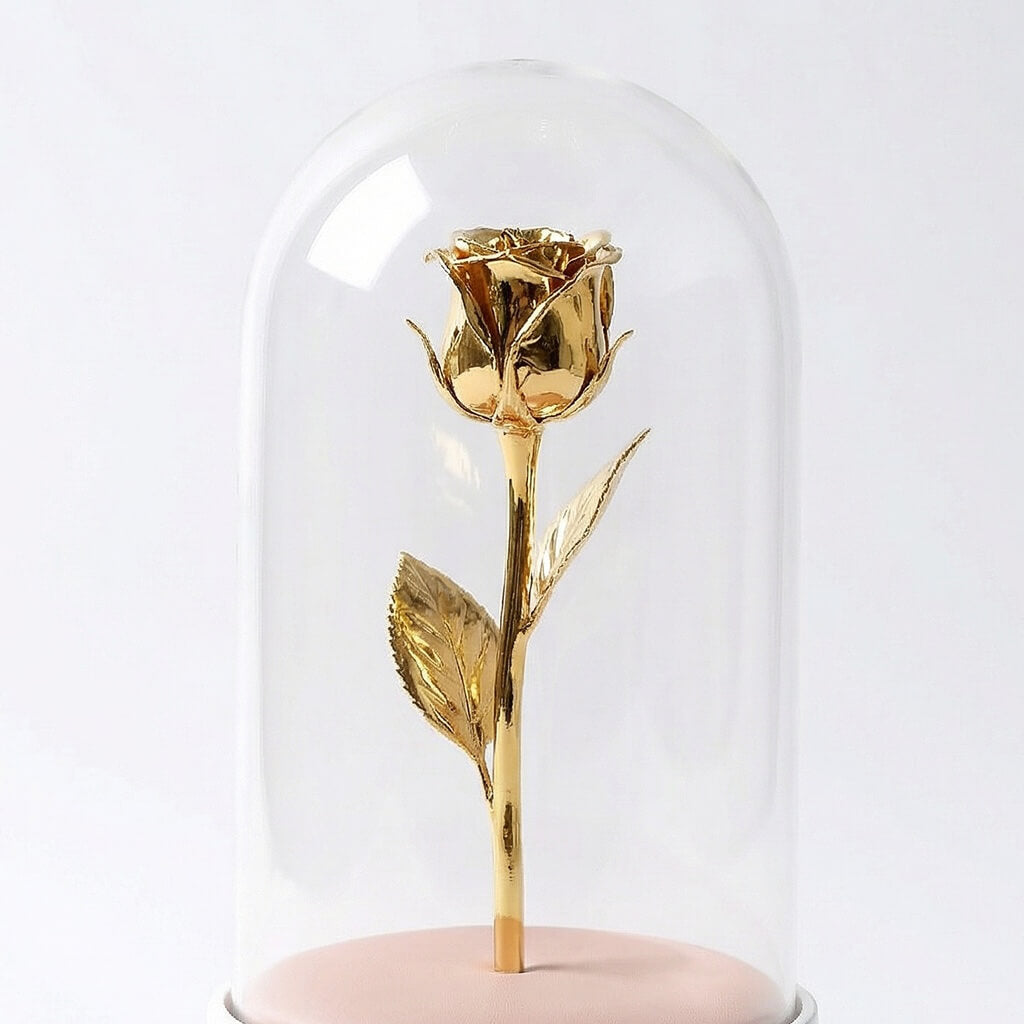 Gold rose inside a glass dome on a white background