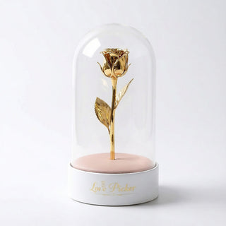 Gold rose inside a glass dome on a white base with 'Love Picker' branding.