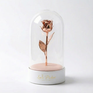 Rose gold rose inside a glass dome on a white base with 'Love Picker' branding.