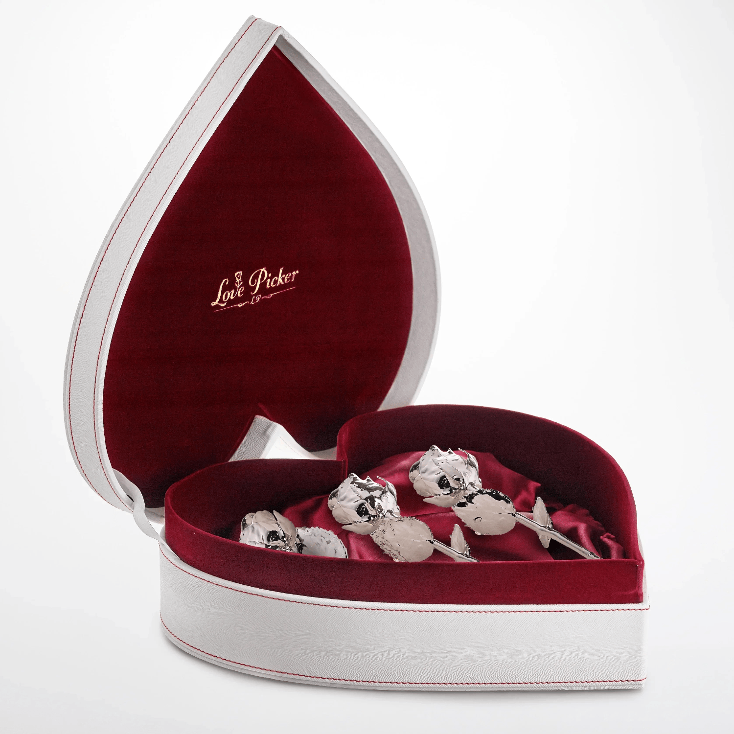 Heart-shaped silver gift box with velvet lining and preserved silver roses inside
