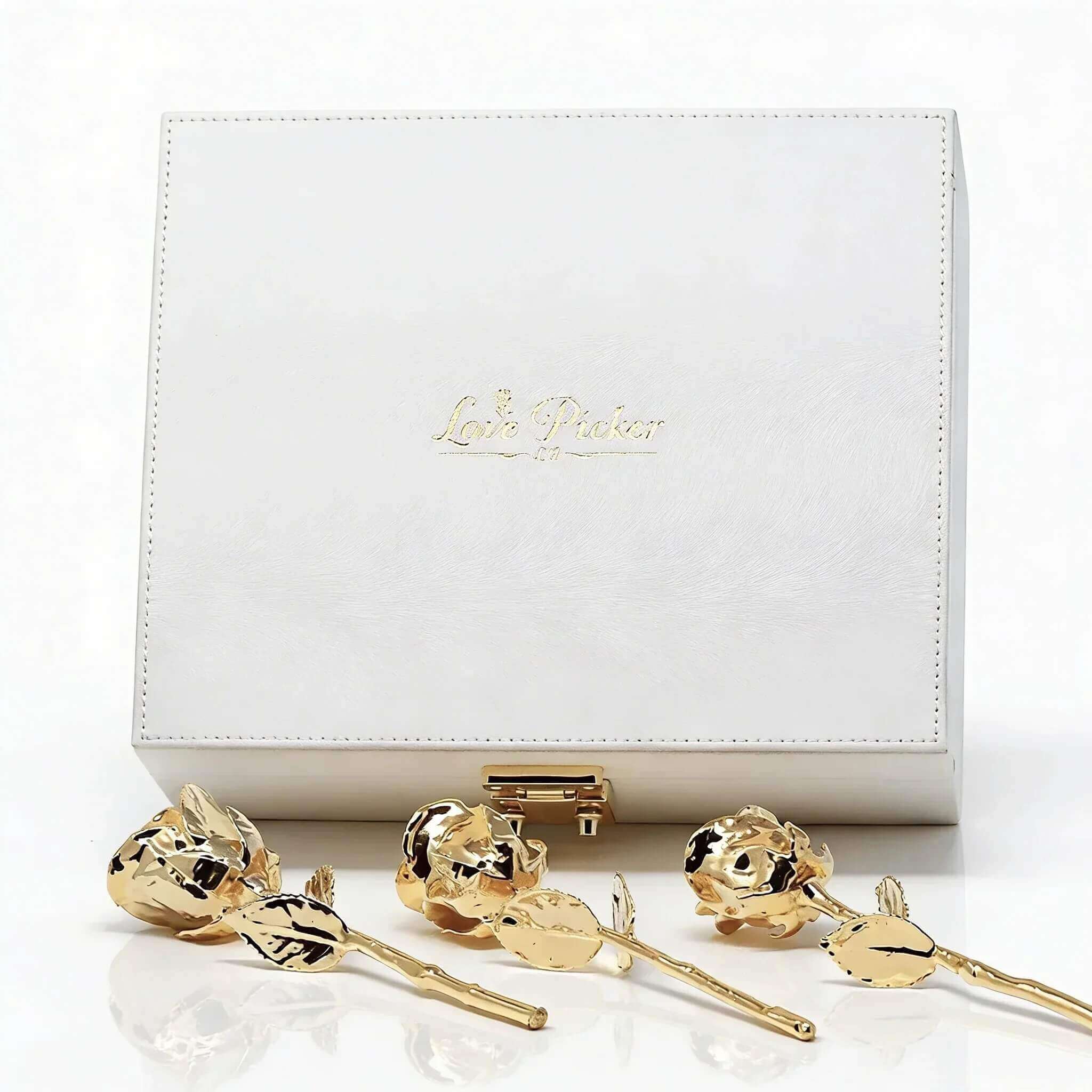 White luxury leather gift box with 3 gold roses on a white background, with branding "lovepicker"