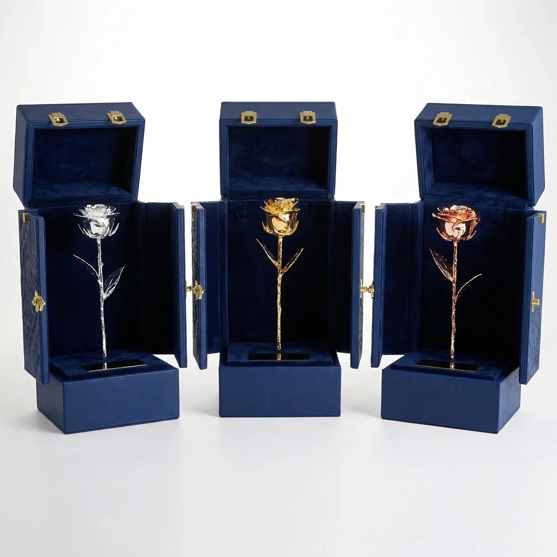 Gold, silver, and rose gold preserved roses in blue velvet gift boxes, elegant luxury gifts
