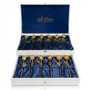 Box of twelve 24K gold preserved roses on blue satin, luxury gift arrangement
