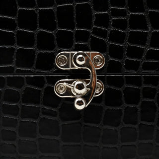 Black crocodile-texture gift box with a silver clasp, luxury floral packaging