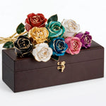 Assorted 24K gold preserved roses in multiple colors displayed on a brown gift box.